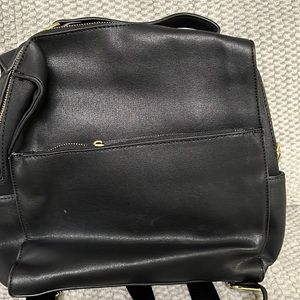 Black leather square backpack.